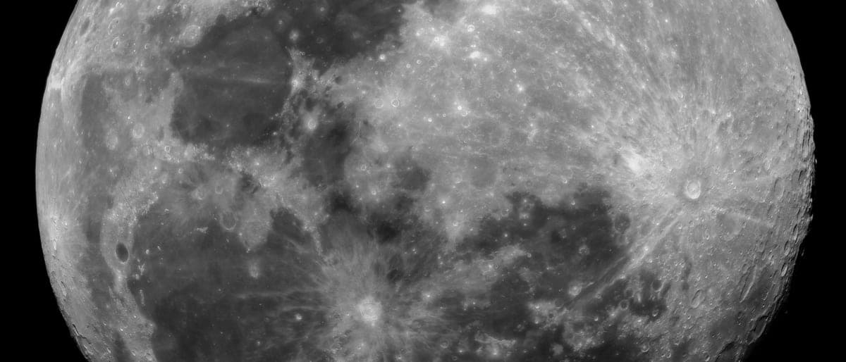 The Moon's cratered surface photographed in black and white