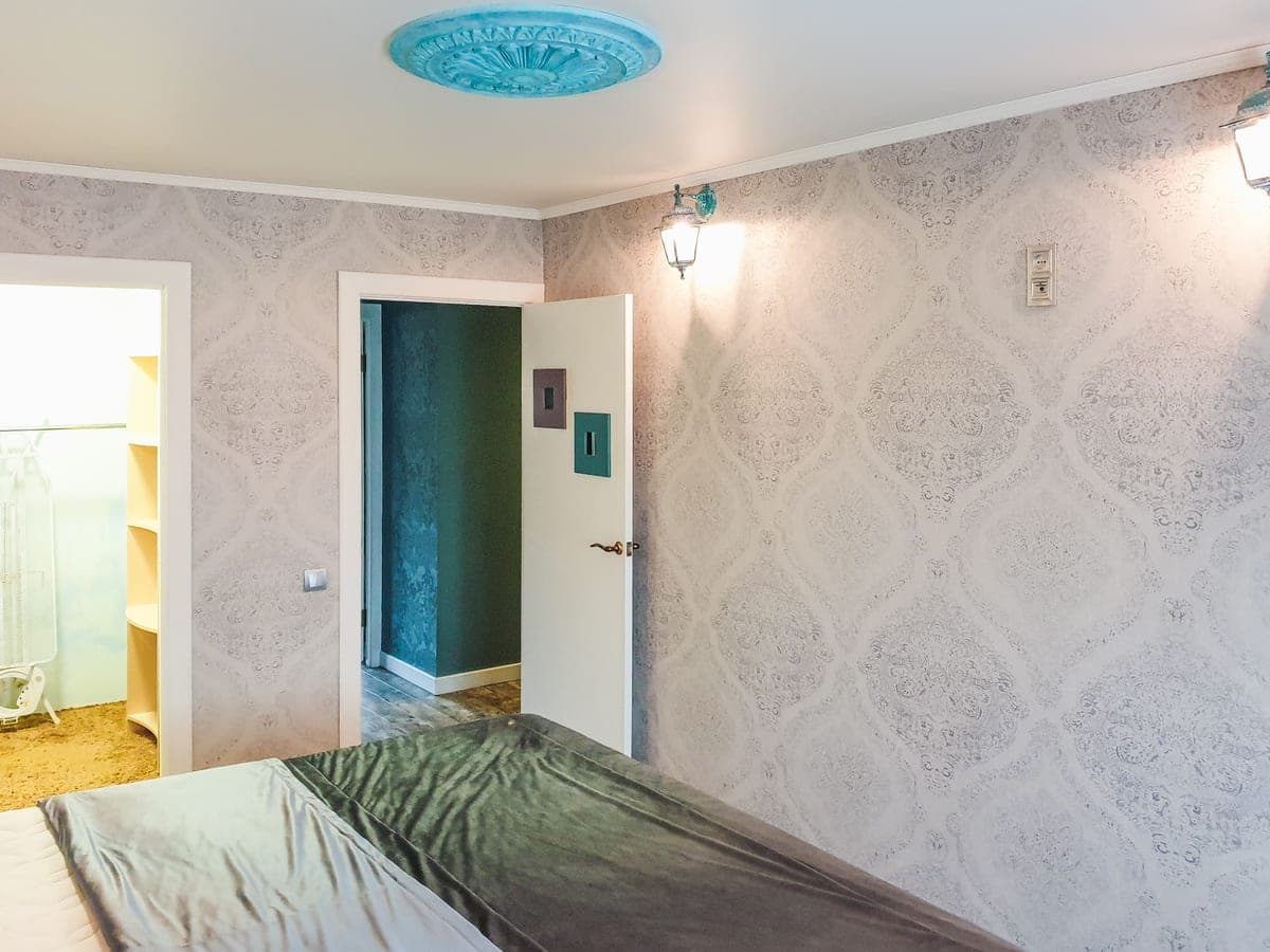 Colored light patterns cast across a bedroom ceiling