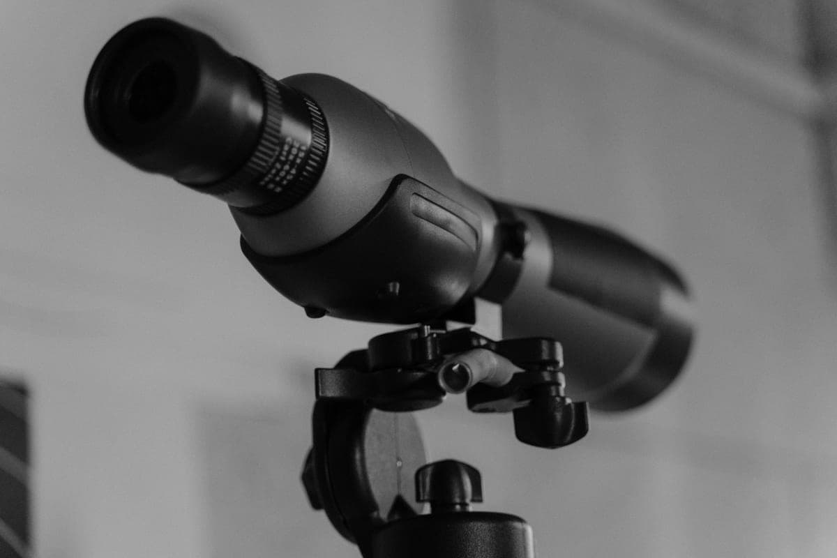 Close-up of a telescope lens and focuser assembly